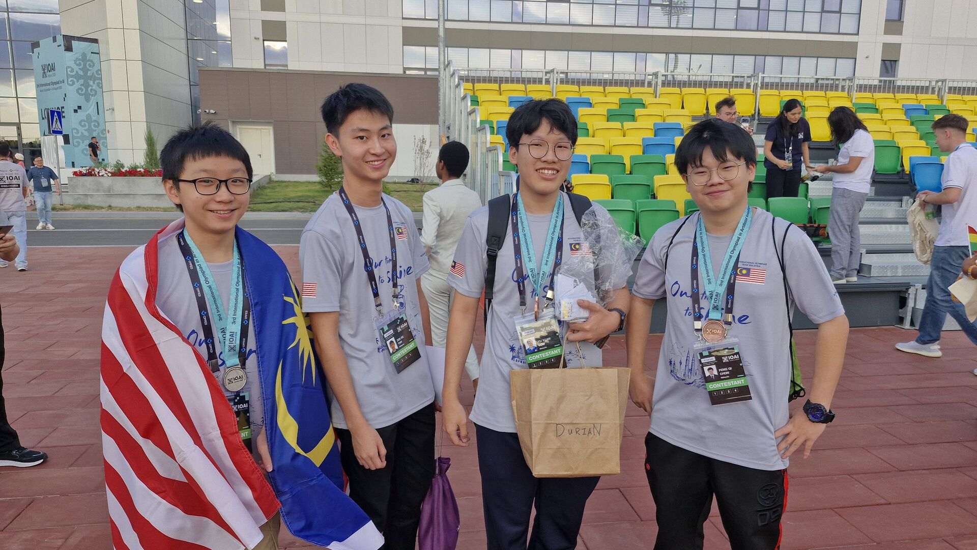 Candid photo of the 2026 Malaysian IOAI team in between mixing with other students