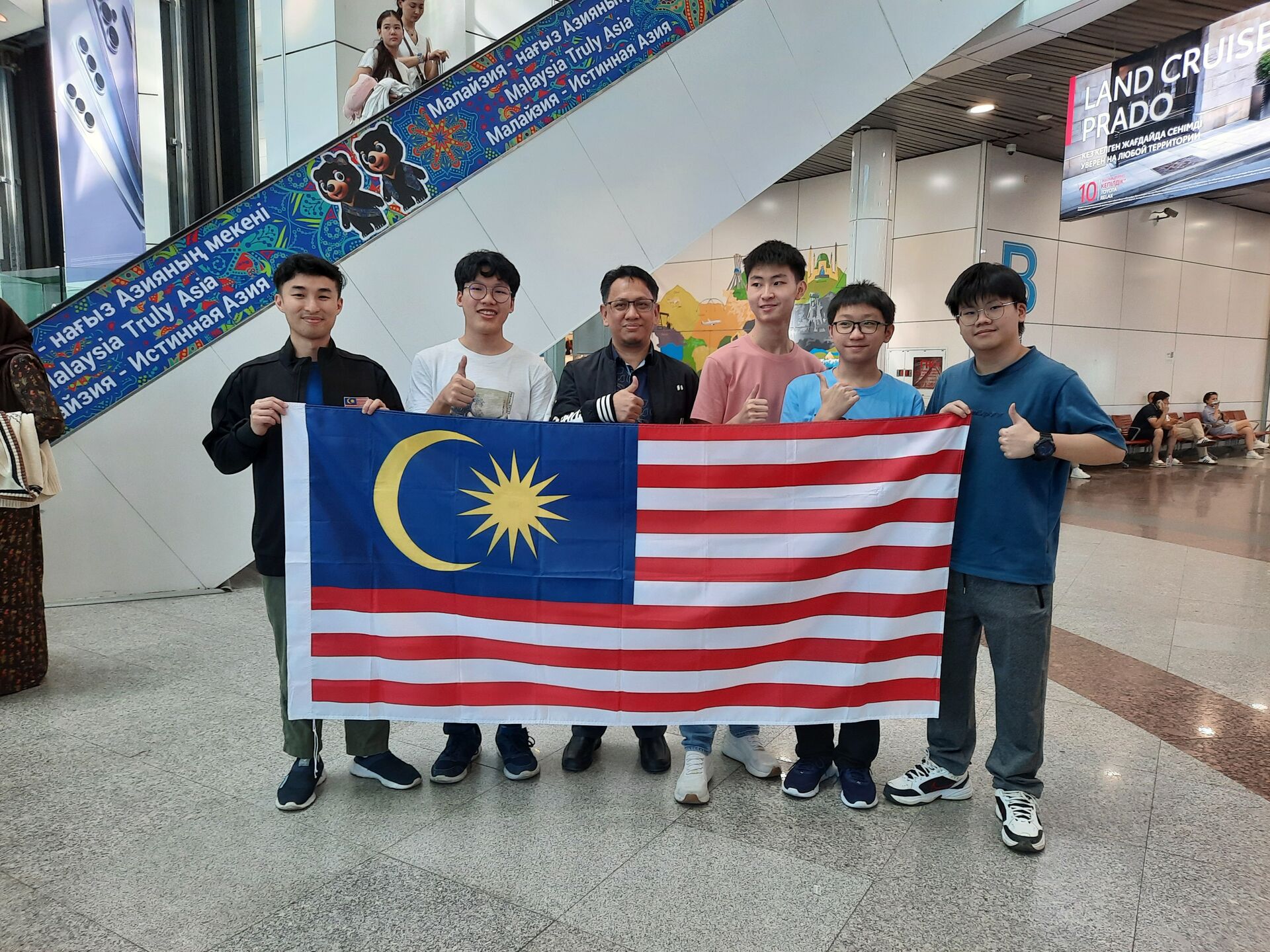 Team Malaysia with the secretary of the Embassy of Malaysia at Astana airport